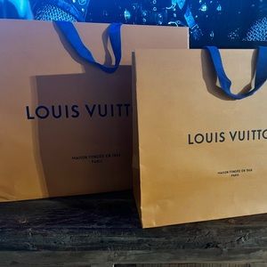 Louis Vuitton 
(2) Shopping bags
Orange